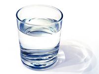 water glass on white background. (drink; clear; clean water; liquid)