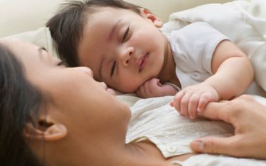 Mother and baby sleeping safely