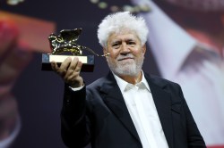 VENICE, ITALY - SEPTEMBER 07: Pedro Almodovar accepts the Golden Lion Award for “The Room Next Door” onstage during the 81st Venice International Film Festival at Sala Grande on September 07, 2024 in Venice, Italy. (Photo by Vittorio Zunino Celotto/Getty Images)