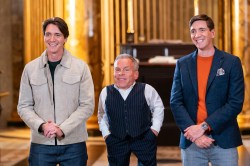 Hosts James Phelps and Oliver Phelps with guest judge Warwick Davis, as seen on Harry Potter: Wizards of Baking, Season 1.