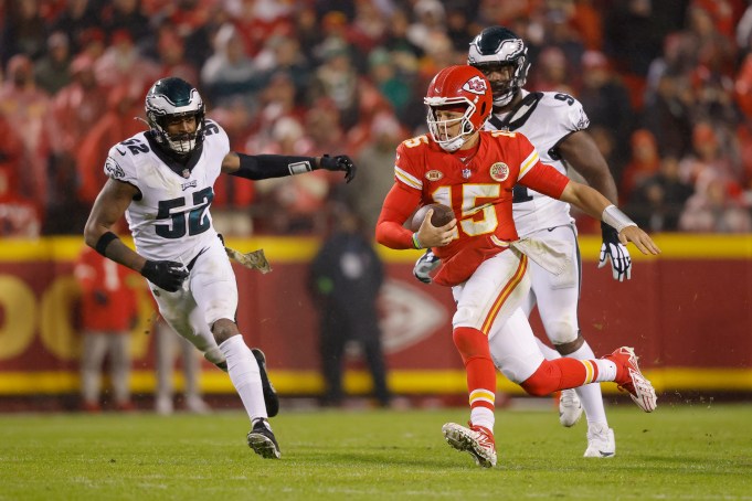 KANSAS CITY, MISSOURI - NOVEMBER 20: Patrick Mahomes #15 of the Kansas City Chiefs scrambles with the ball against the Philadelphia Eagles in the second half at GEHA Field at Arrowhead Stadium on November 20, 2023 in Kansas City, Missouri. (Photo by David Eulitt/Getty Images)