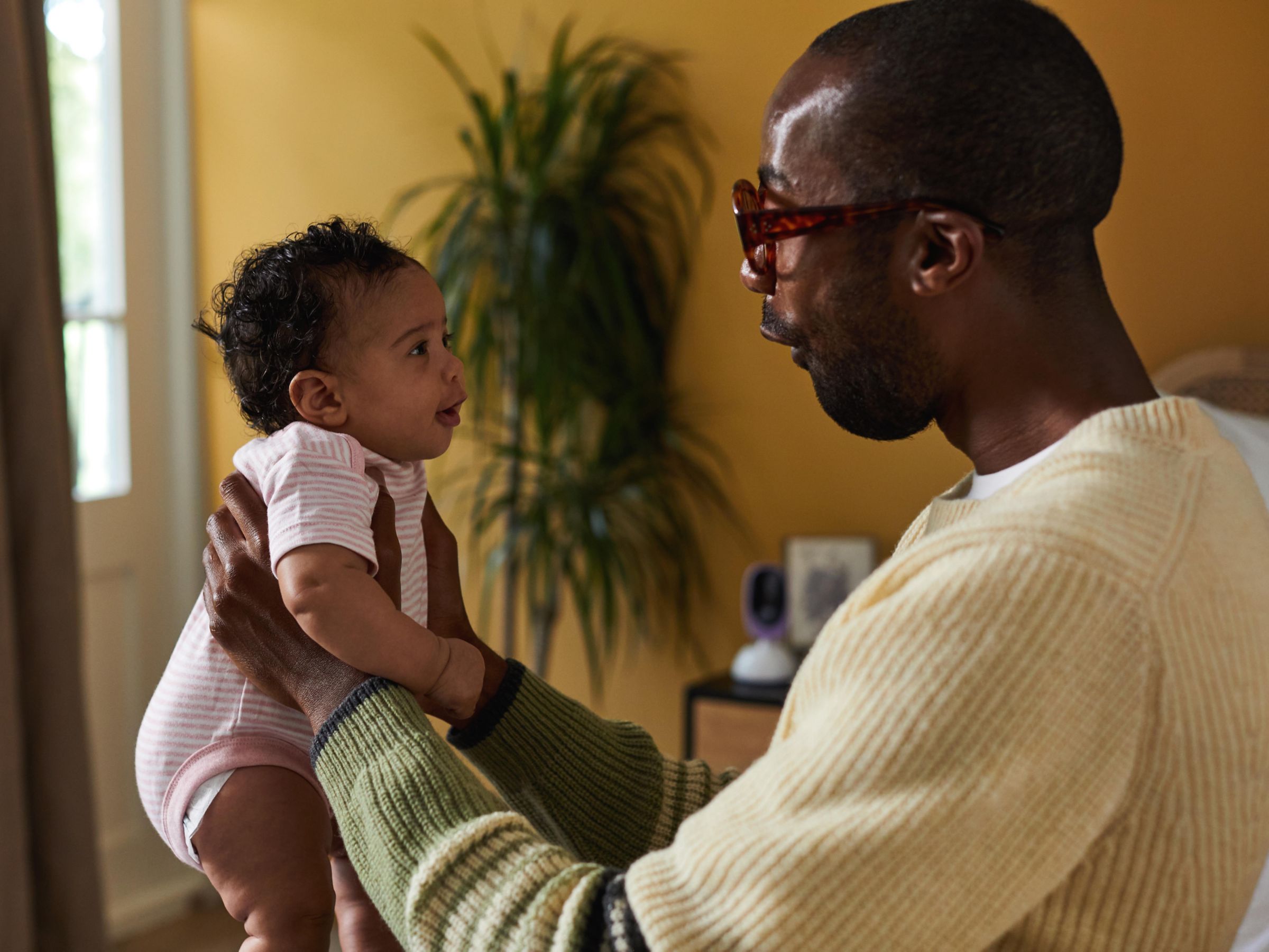 Father holding baby aloft