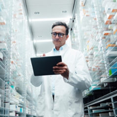 pharmacist with a tablet