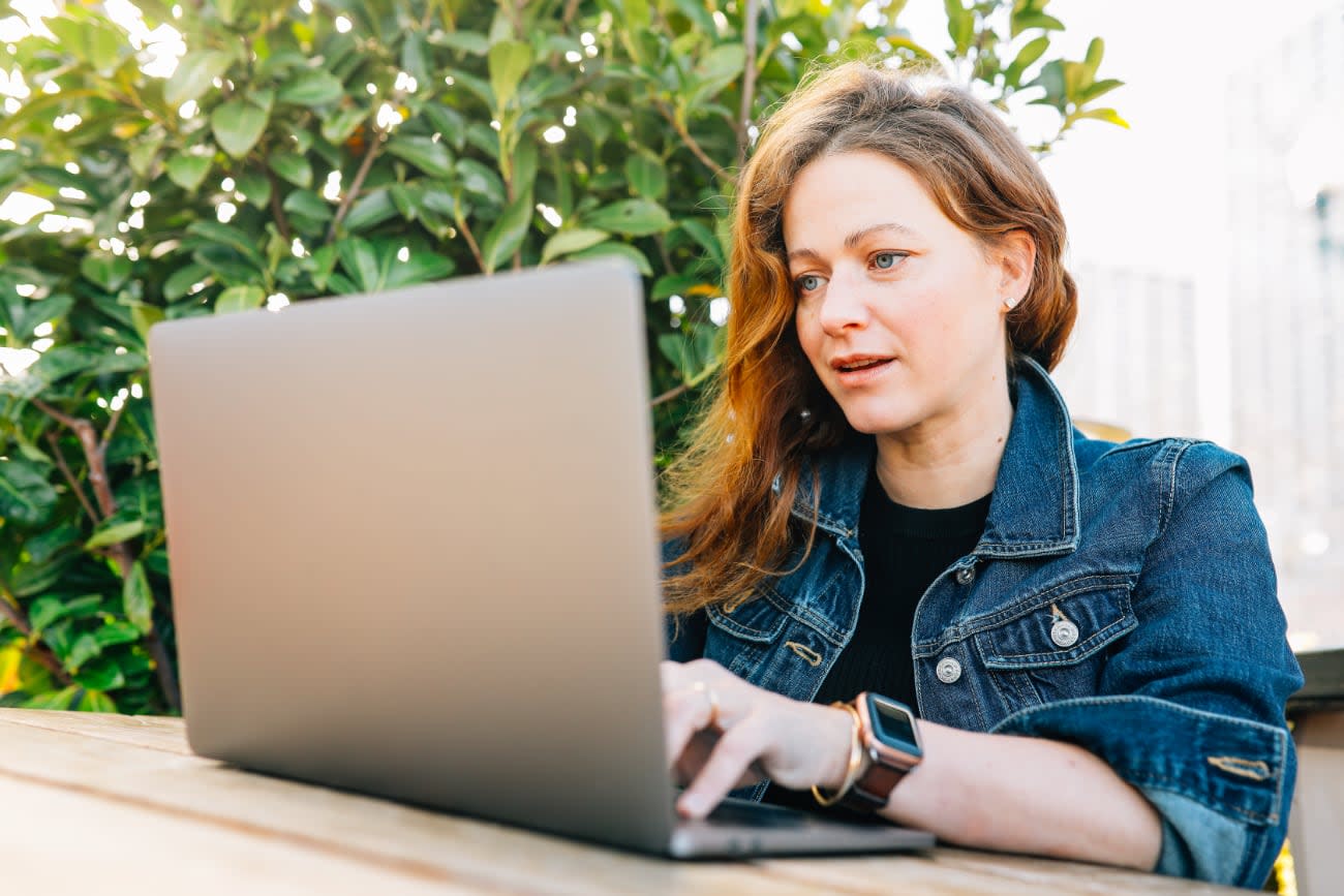 Photo of Kathy Korevec working outdoors.