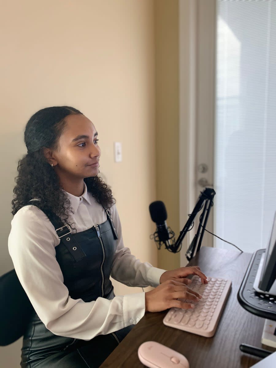 Photo of Safia Abdalla at her creative station.