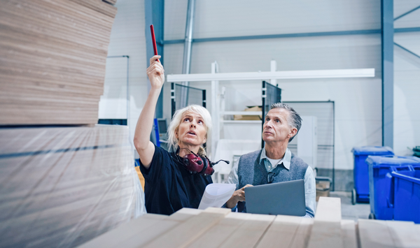 People looking at a wood storage