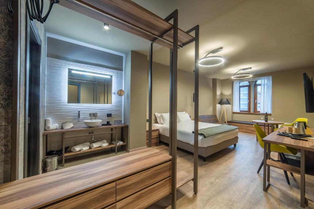 9 stanze - Boutique Rooms tesisinde bir odada yatak veya yataklar