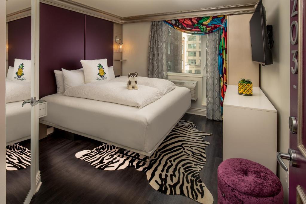 A bed or beds in a room at Staypineapple, An Artful Hotel, Midtown New York