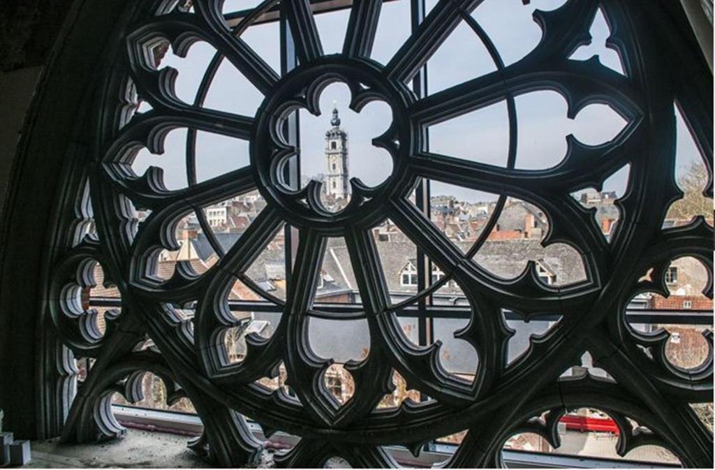 a view of a window with a cross on it at Martin's Dream Hotel in Mons