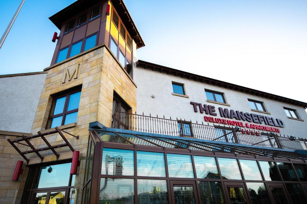 a building with a sign on the side of it at The Mansefield Hotel in Elgin