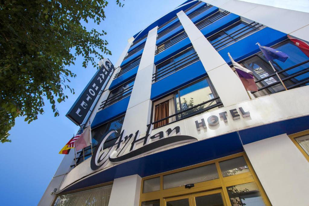 a building with the sign of the columbian hotel at Ayhan Hotel in Antalya