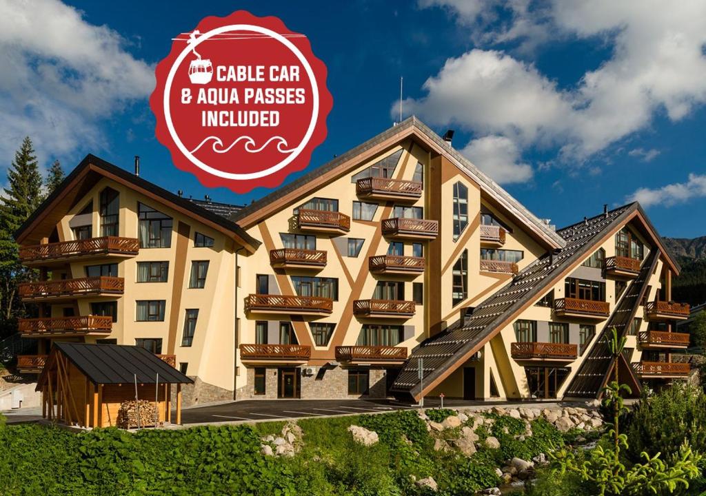 a hotel with a sign that reads the cubic car and a union process involved at Hotel Pošta in Demanovska Dolina