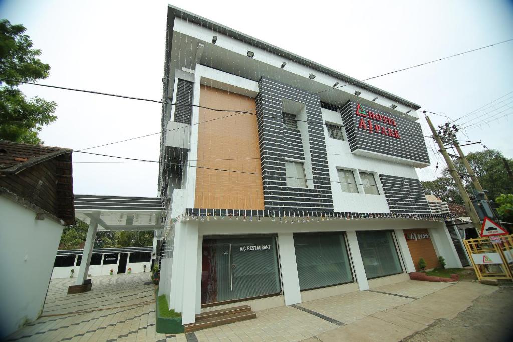 un edificio con un cartel en el costado en Hotel A J Park, en Alleppey