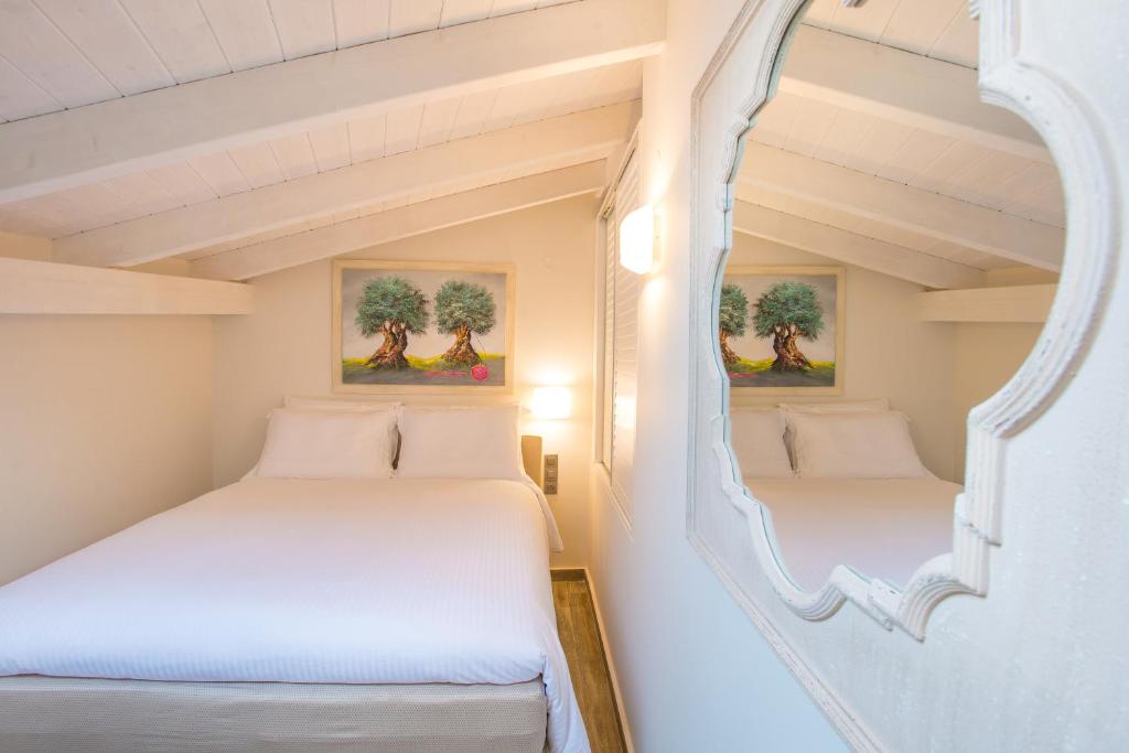 Una cama o camas en una habitación de Villa Vilielmini