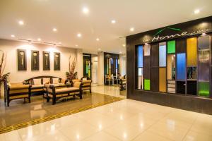 a store lobby with furniture and a store sign at At Home at Udon in Udon Thani