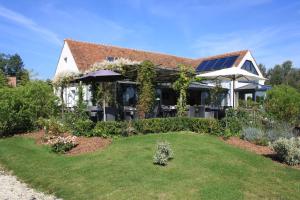 A garden outside Domaine de Bellevue, The Originals Relais