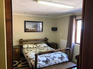 A bed or beds in a room at Mount Nebo Hillside Reserve