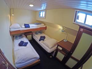 Cama ou camas em um quarto em Botel Elodie