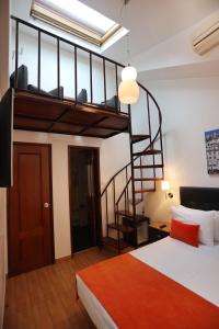 a bedroom with a loft bed and a staircase at Anjo Azul in Lisbon