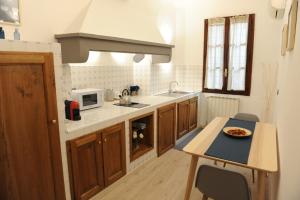 a kitchen with a table with a plate of food on it at Domus Plaza in Florence