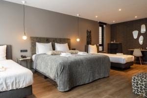 Een bed of bedden in een kamer bij Boutique Suites Lisse - Schiphol