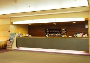 a waiting area of a store with a counter at skyhotel uozu / Vacation STAY 59577 in Uozu