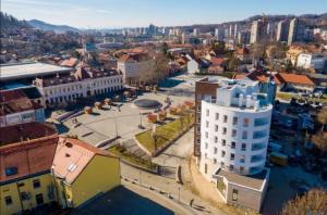 an aerial view of a city with buildings at Apartment La Mia in Tuzla