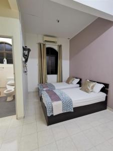 Uma cama ou camas num quarto em Warni Villa 8 Whole Or Room