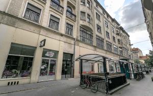 a building with a bike parked in front of it at Catalog Boutique Rooms in Debrecen