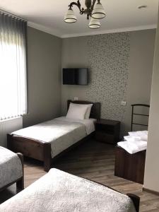 Ліжко або ліжка в номері Gray Hotel