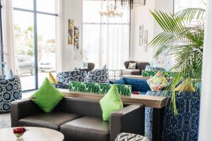 a living room with couches and a table at Wazo Appart-Hôtel in Marrakesh