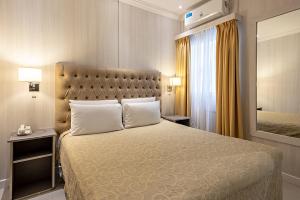 Giường trong phòng chung tại Hotel Nuevo Ostende by bund