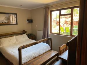 A bed or beds in a room at Mount Nebo Hillside Reserve