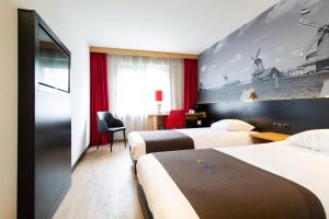 Ліжко або ліжка в номері Bastion Hotel Zaandam