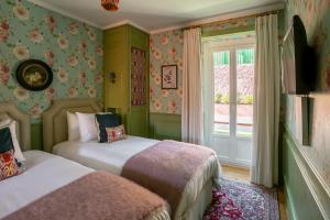 Posteľ alebo postele v izbe v ubytovaní Rosegarden House - by Unlock Hotels