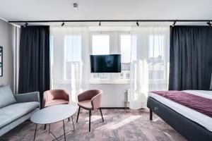 A bed or beds in a room at Hotel Fridhem