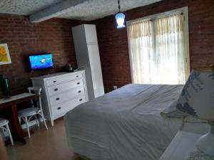 TV/trung tâm giải trí tại Apartamento no Centro de Gramado