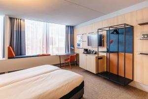 Säng eller sängar i ett rum på Hotel Casa Amsterdam
