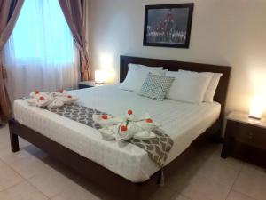 Krevet ili kreveti u jedinici u objektu Venezia Suites Hotel Iloilo