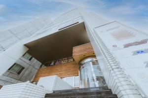 a tall building with stairs in front of it at The Stay Sapporo in Sapporo