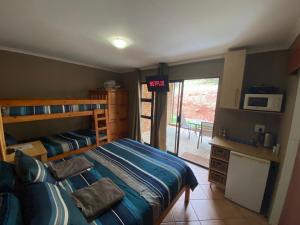 A bed or beds in a room at Mount Nebo Hillside Reserve