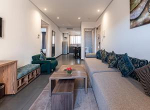 a living room with a couch and a table at Wazo Appart-Hôtel in Marrakesh