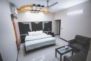 Tempat tidur dalam kamar di Royal Accommodation