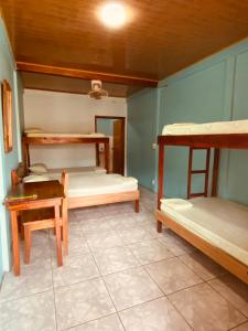 A bed or beds in a room at Cabinas Popular