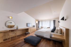 A bed or beds in a room at BIRD HOTEL