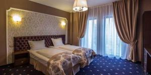 Кровать или кровати в номере Hotel Bulevard