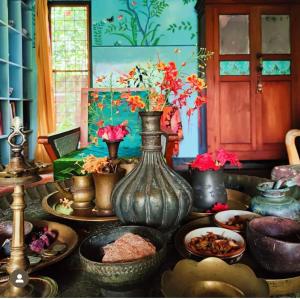 a group of vases and bowls sitting on a table at Villa Jacaranda in Varkala