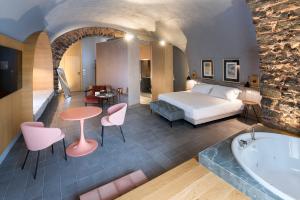 Voodi või voodid majutusasutuse BASTIÒ PRIVATE SUITES toas