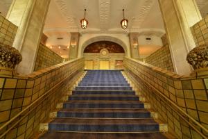 a staircase in a building with blue stairs at Hotel New Grand in Yokohama