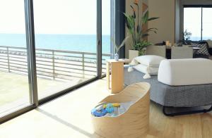 a living room with a view of the ocean at tramonto.blu in Tsushi